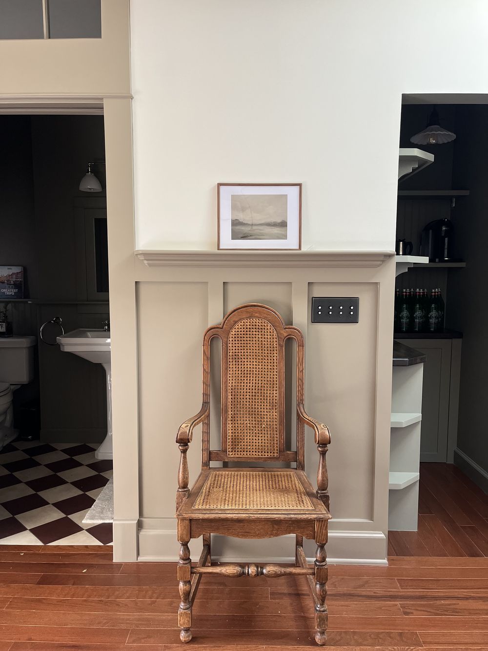 Craftsman ADU millwork detail with antique cane chair and push-button switches